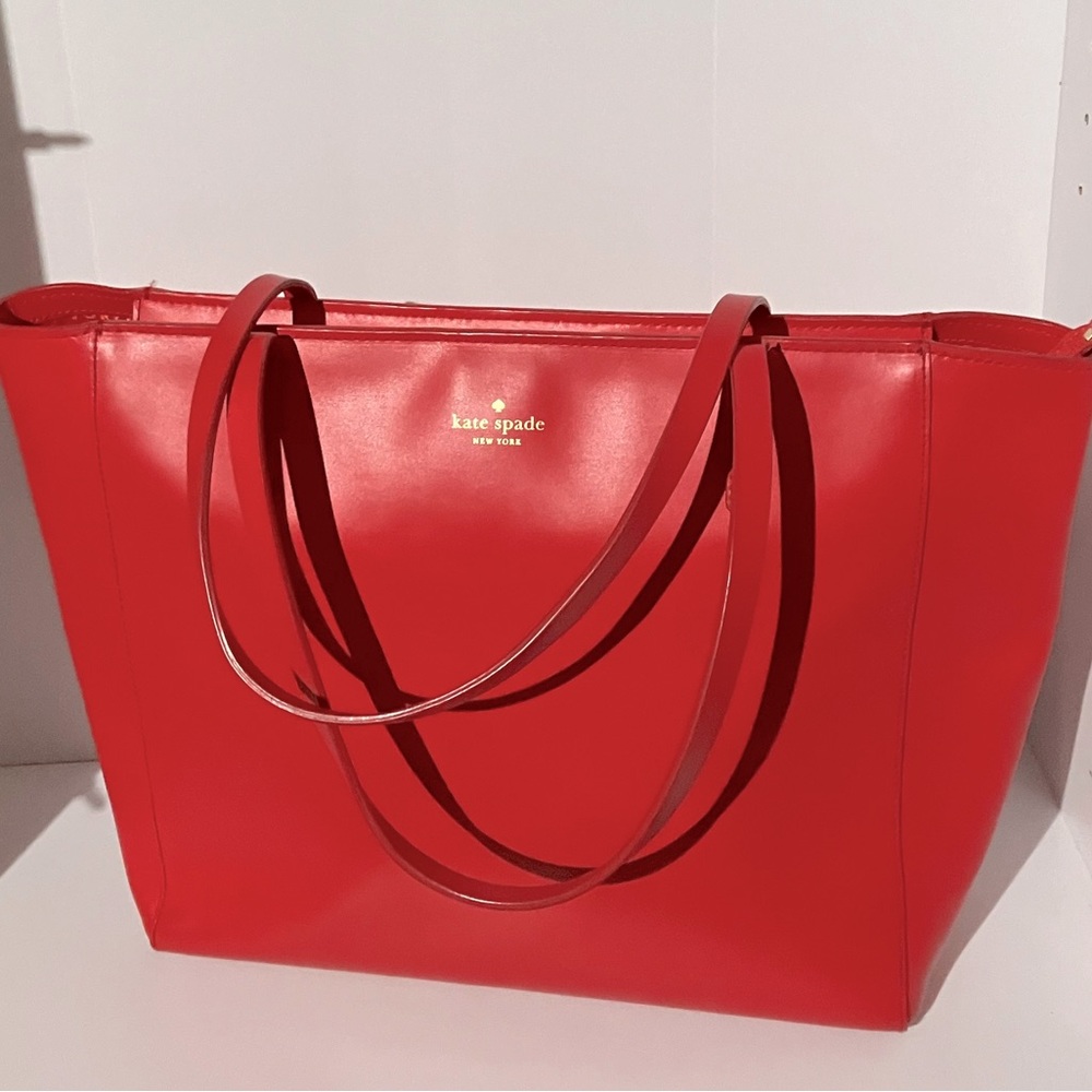 27 Kate Spade leather tote good condition with minimal wear on corners
